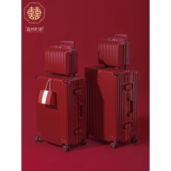 A pair of red leather wedding suitcases/dowry trunks for brides, featuring a combination lock.