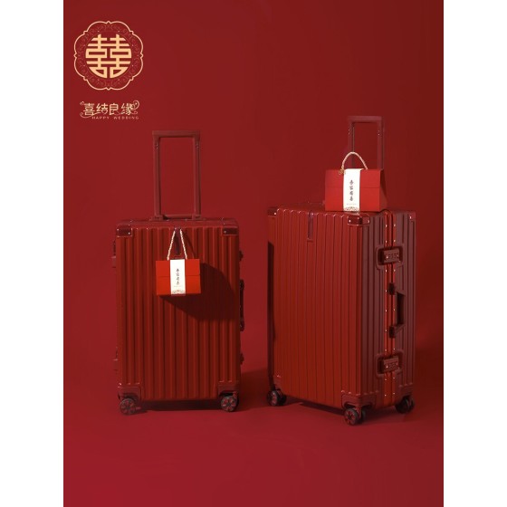 A pair of red leather wedding suitcases/dowry trunks for brides, featuring a combination lock.